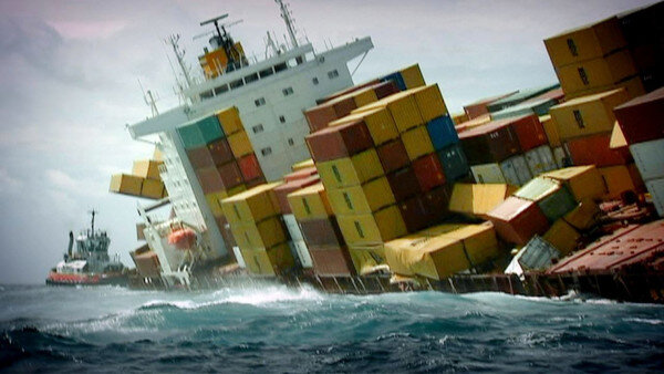 Container Ship At Sea With Containers Falling Into The Ocean